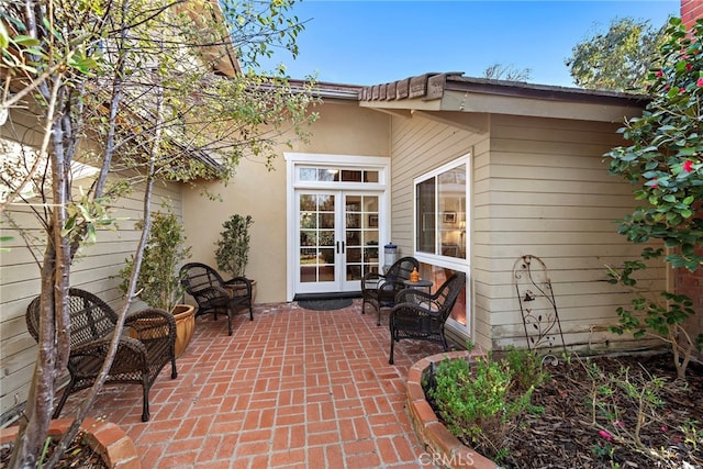 view of patio featuring french doors