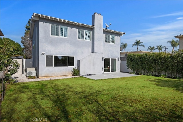 rear view of property with ac unit, a lawn, and a patio