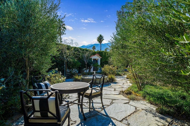 view of patio / terrace featuring a mountain view