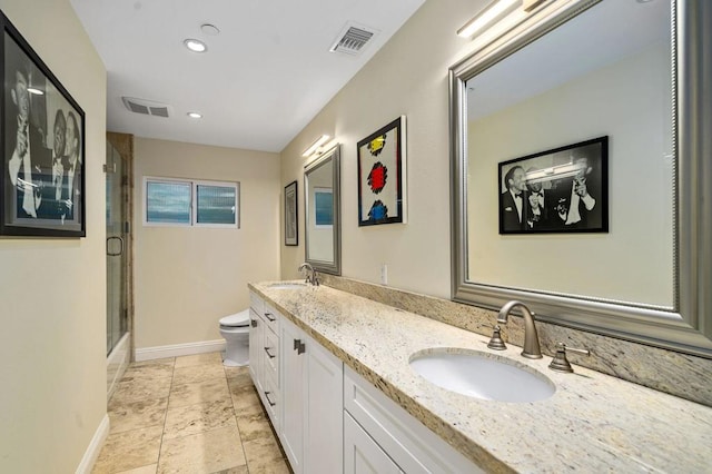 full bathroom featuring shower / bath combination with glass door, vanity, and toilet