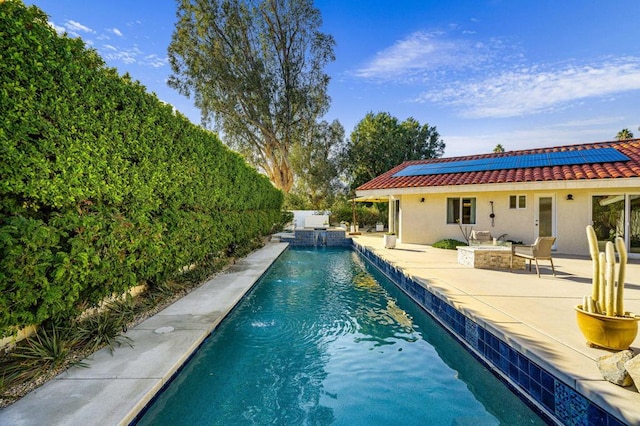 view of swimming pool with a patio area and pool water feature