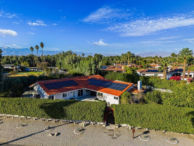 birds eye view of property featuring a mountain view