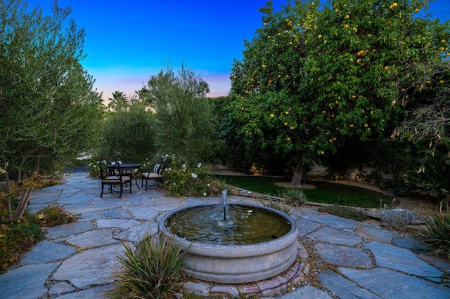 view of patio terrace at dusk