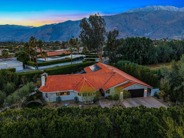 aerial view at dusk with a mountain view