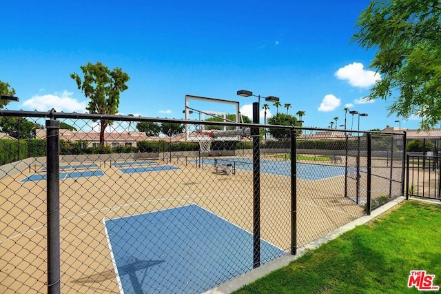 view of property's community with basketball court