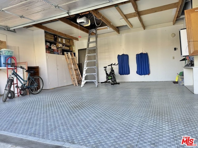 garage featuring a garage door opener