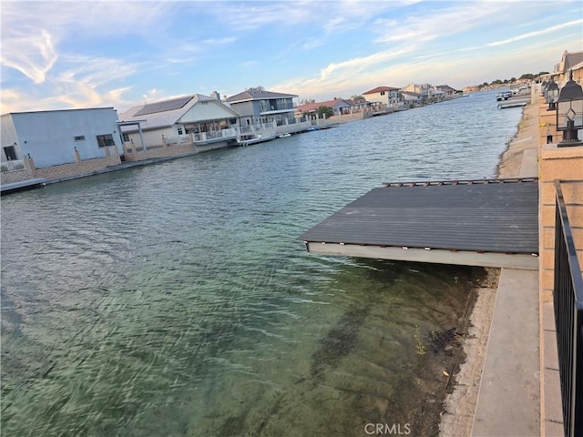 dock area with a water view