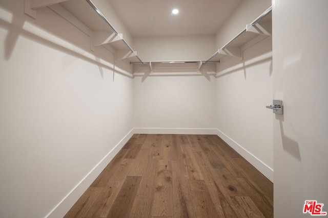 walk in closet featuring hardwood / wood-style floors