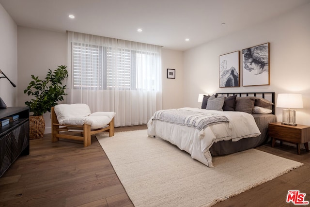 bedroom featuring dark wood-type flooring