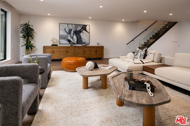 living room with light hardwood / wood-style flooring