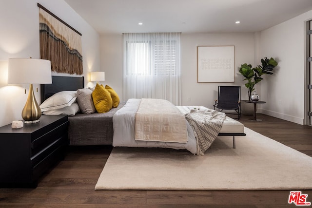 bedroom featuring dark wood-type flooring