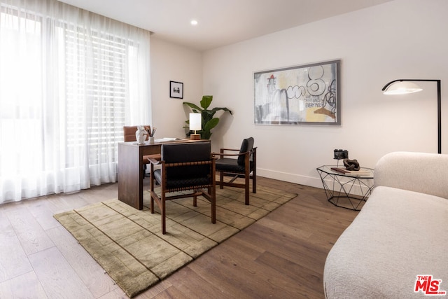 office space with hardwood / wood-style flooring