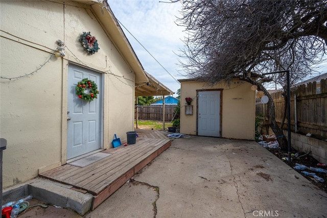 doorway to property with a patio area