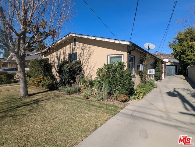 view of side of property featuring a yard