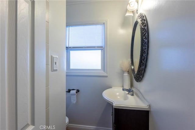 bathroom with vanity and toilet