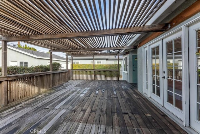 deck featuring a pergola and french doors