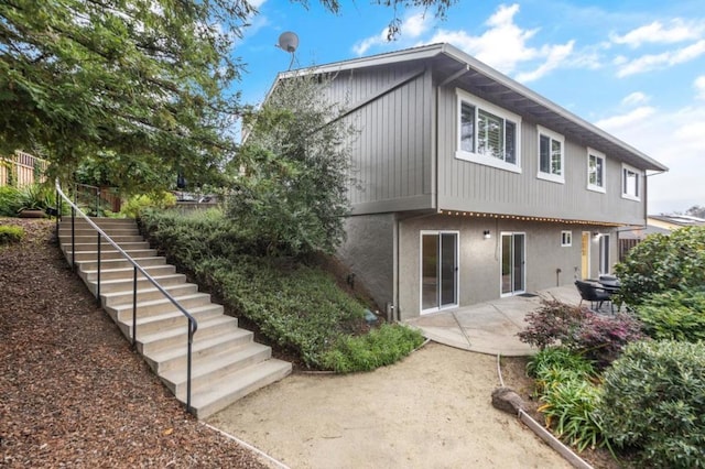 back of property with a patio area