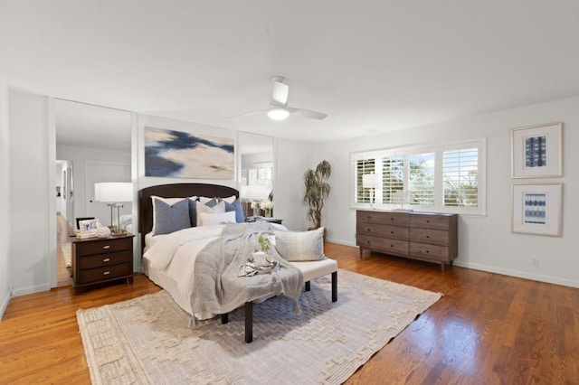 bedroom with hardwood / wood-style floors and ceiling fan