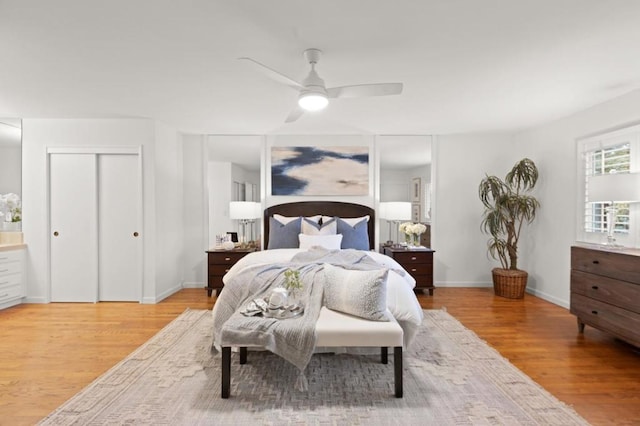 bedroom with ceiling fan and light wood-type flooring