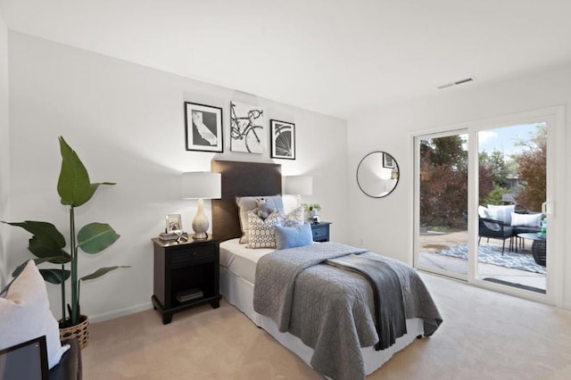 bedroom featuring access to outside and light colored carpet