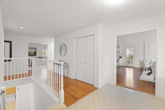 hall with light hardwood / wood-style floors