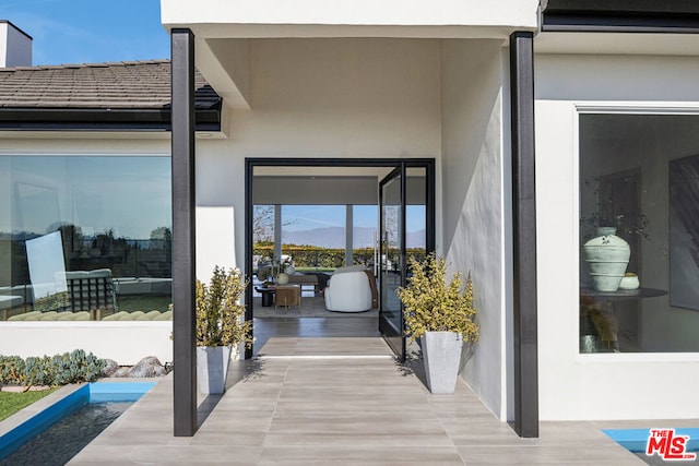 doorway to property featuring a mountain view