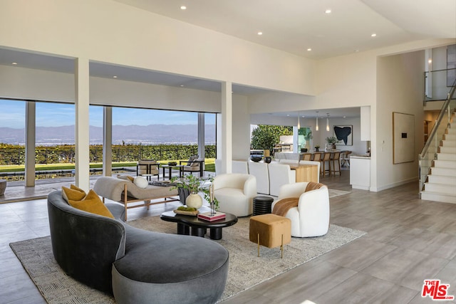 living room with a mountain view and high vaulted ceiling