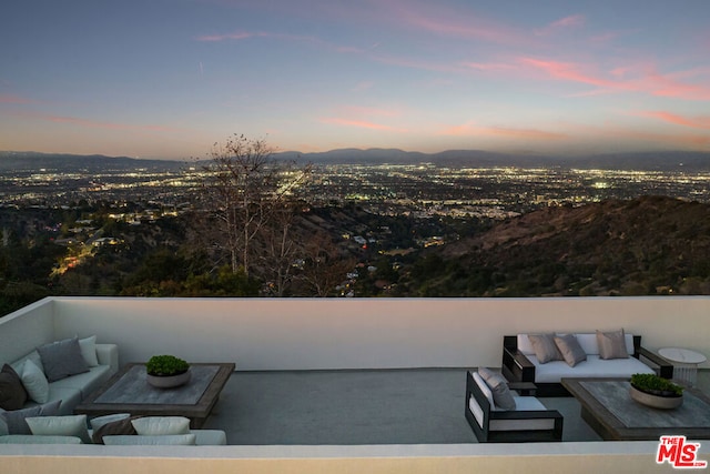 patio terrace at dusk with outdoor lounge area