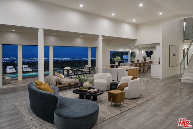 living room with a towering ceiling