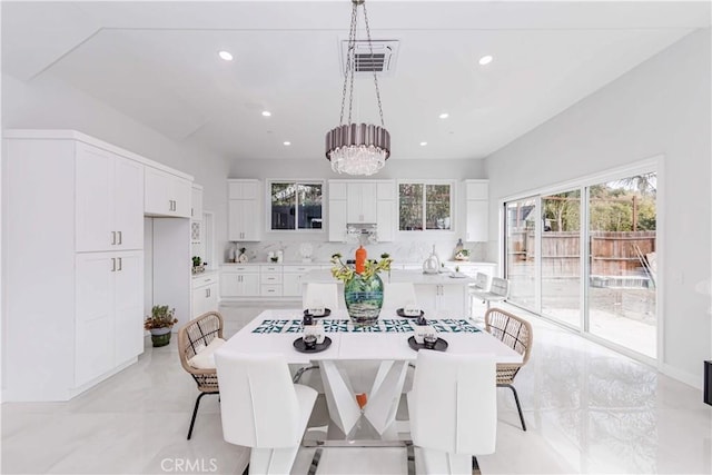 dining room with a notable chandelier