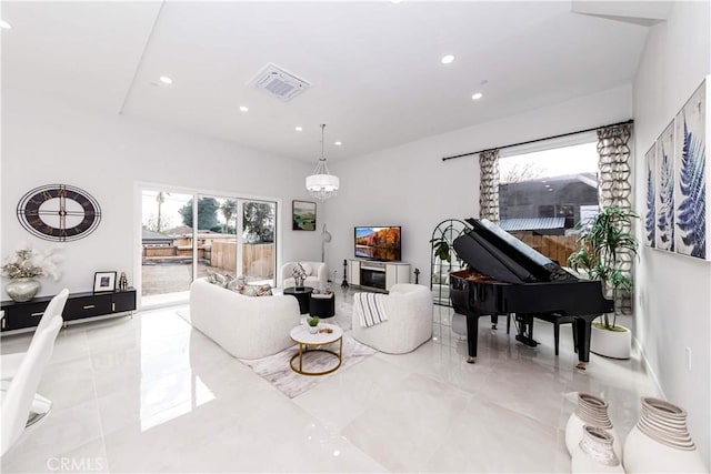 living room featuring an inviting chandelier