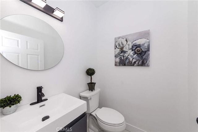 2926 Future St, Los Angeles, CA 90065 - half bathroom with toilet, vanity, and baseboards