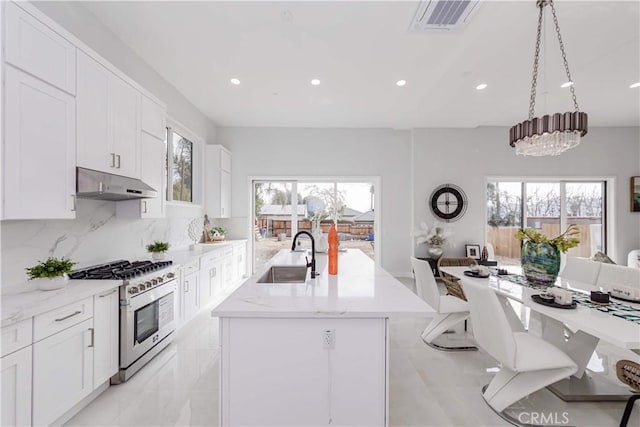2926 Future St, Los Angeles, CA 90065 - kitchen featuring high end range, a sink, under cabinet range hood, an island with sink, and light stone counters