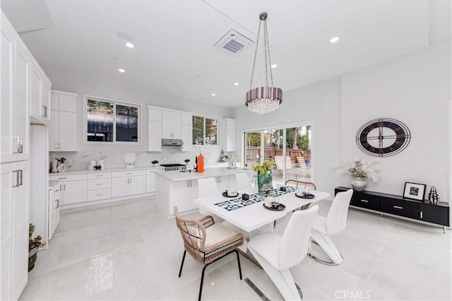 dining space featuring an inviting chandelier