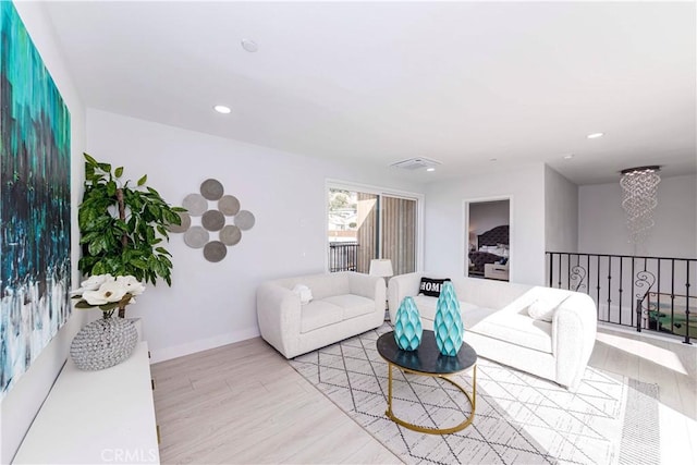 living room with light hardwood / wood-style flooring