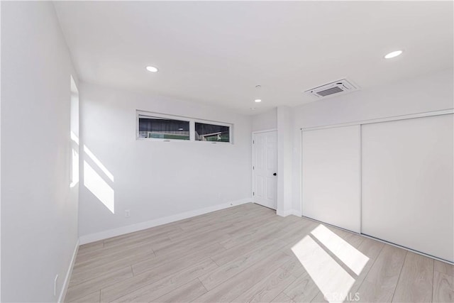 2926 Future St, Los Angeles, CA 90065 - unfurnished bedroom with light wood-type flooring, recessed lighting, baseboards, and a closet