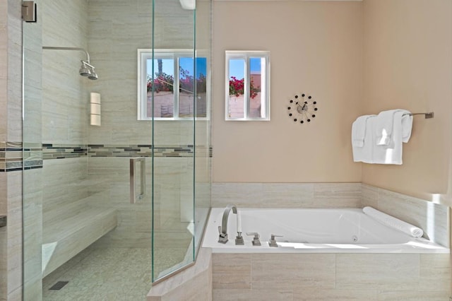 bathroom with separate shower and tub