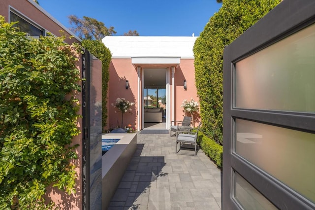 entrance to property with a patio area