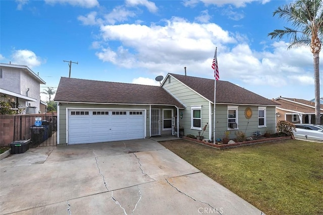 view of front of house with a garage and a front yard