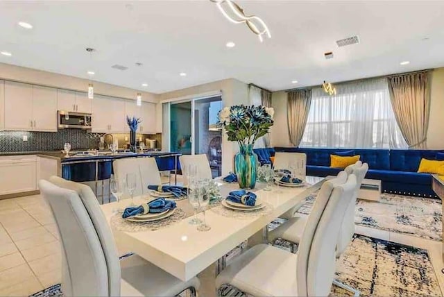 dining area featuring light tile patterned floors