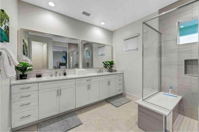 bathroom with vanity and walk in shower