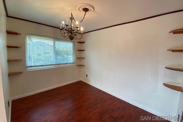 unfurnished room featuring crown molding, dark wood-type flooring, and a notable chandelier