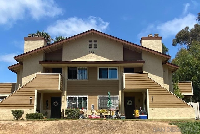 view of front of house featuring a balcony