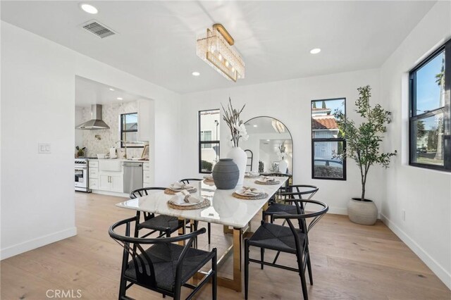 dining space featuring light hardwood / wood-style flooring