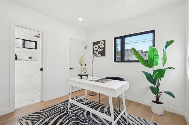 office space with hardwood / wood-style flooring