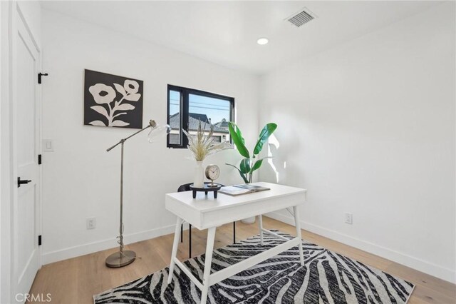 office space featuring hardwood / wood-style floors