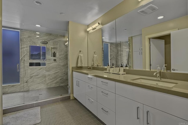 bathroom featuring vanity, an enclosed shower, and tile patterned floors