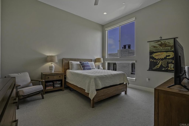 carpeted bedroom featuring ceiling fan