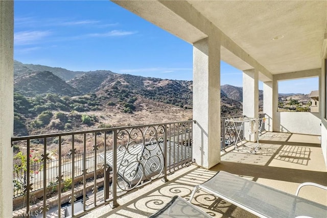 balcony featuring a mountain view