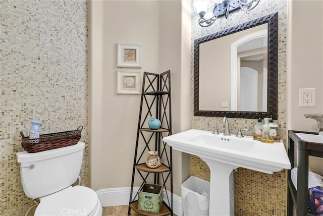 bathroom with sink and toilet